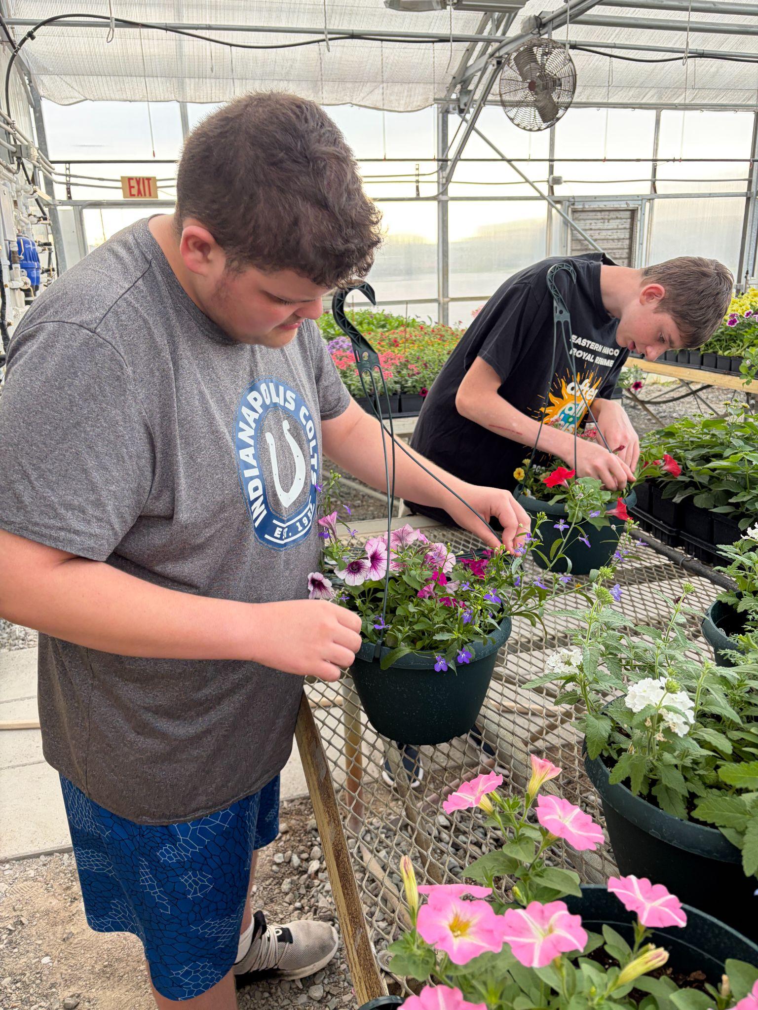 Students working in the Eastern Hancock greenhouse
